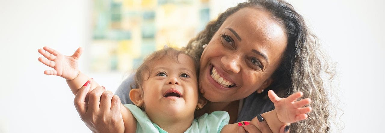 Mother and toddler smiling in a clean, healthy home