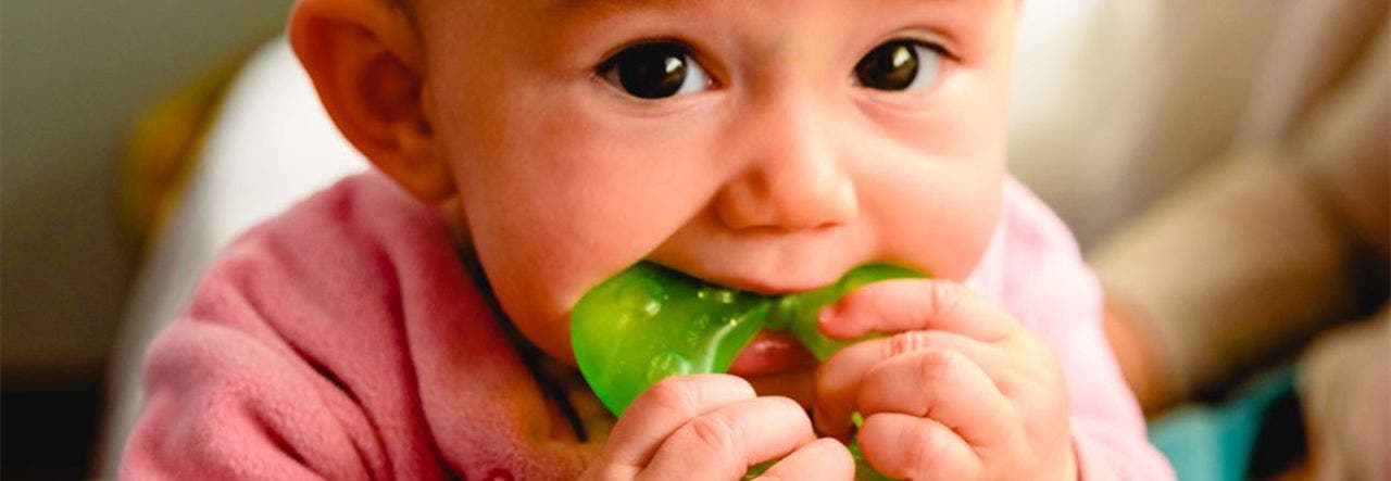 Baby chewing on non-toxic teething toy