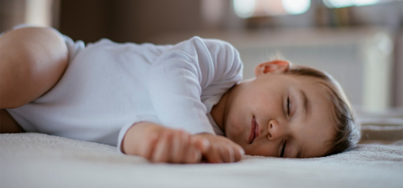 Baby sleeping soundly in the crib