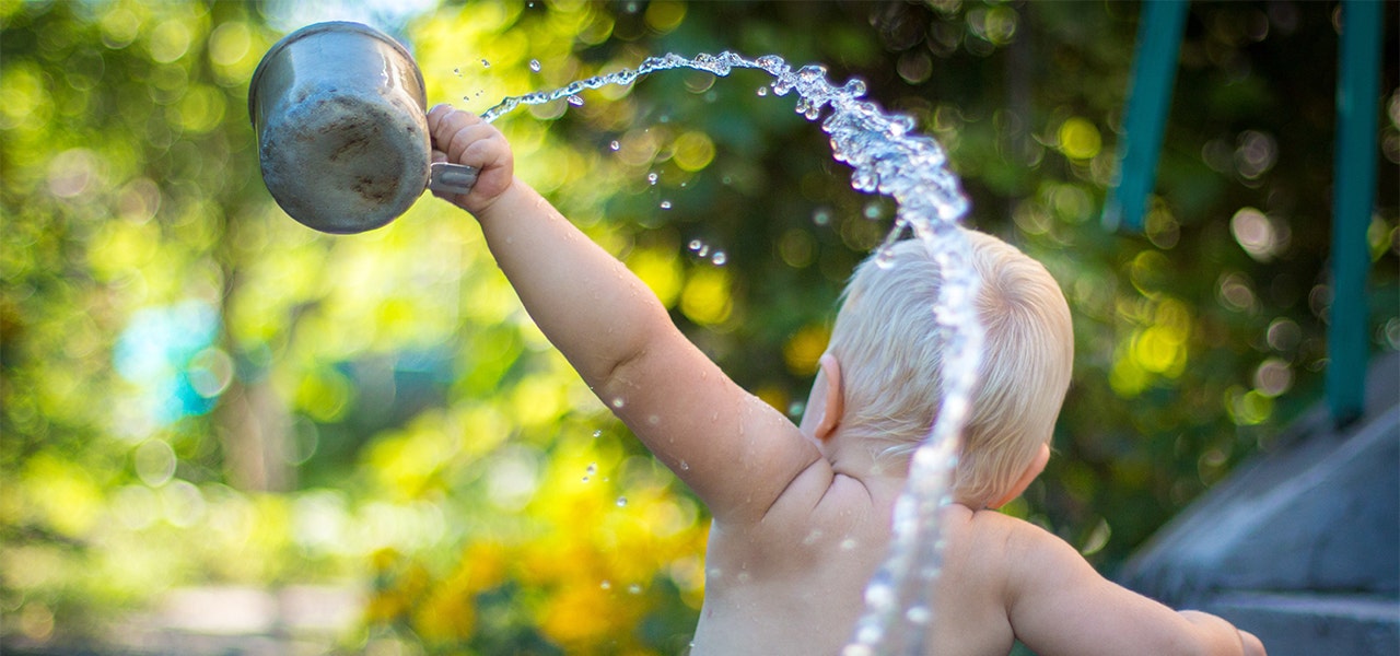 Toddler playing with water for sensory play time