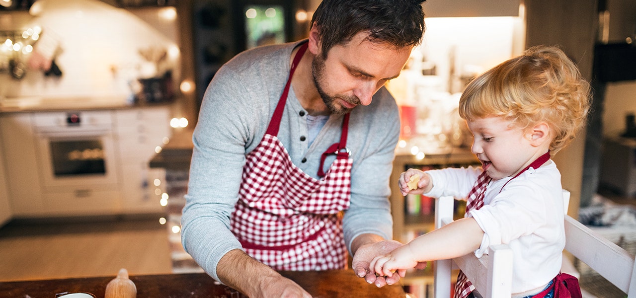 father and child baking together