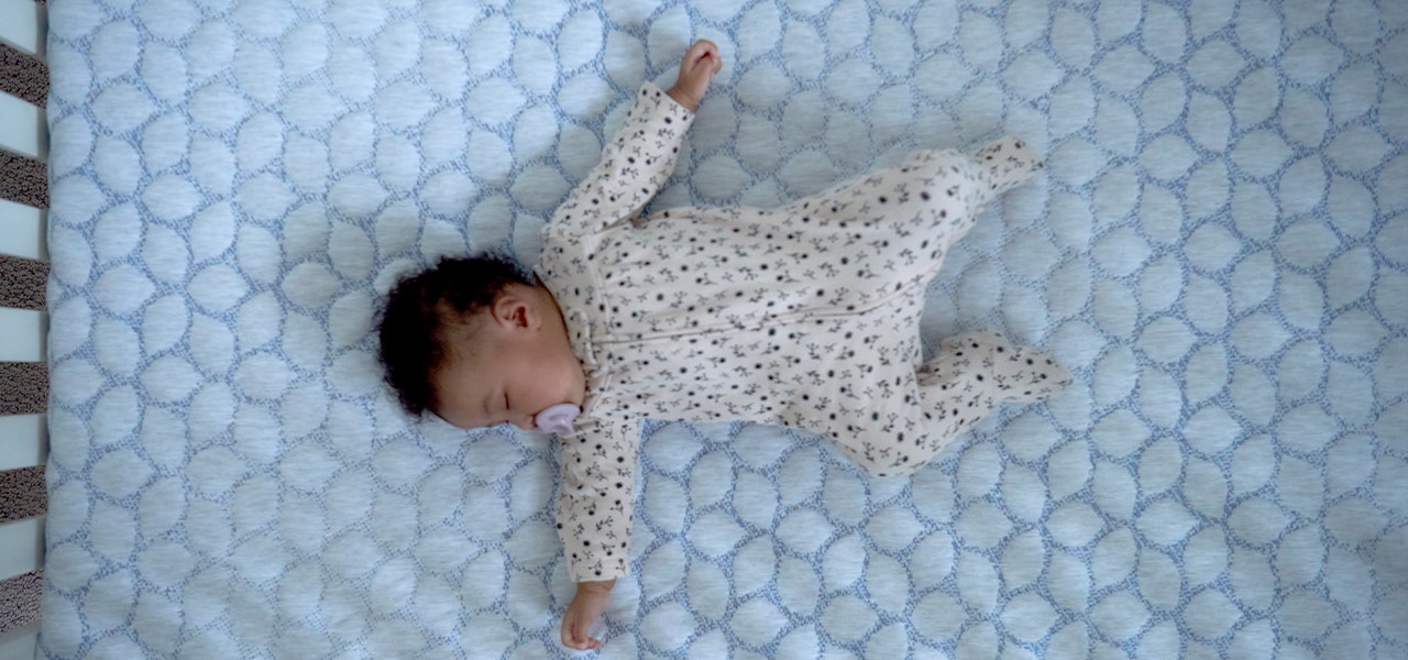 baby sleeping on lullaby earth gentle start crib mattress