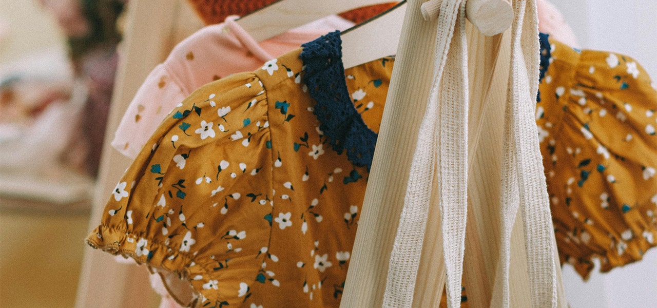 kids clothes hanging on a rack