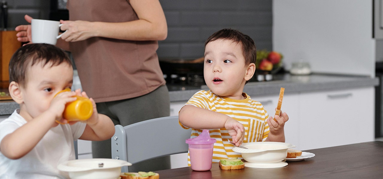 children at a table eating breakfast